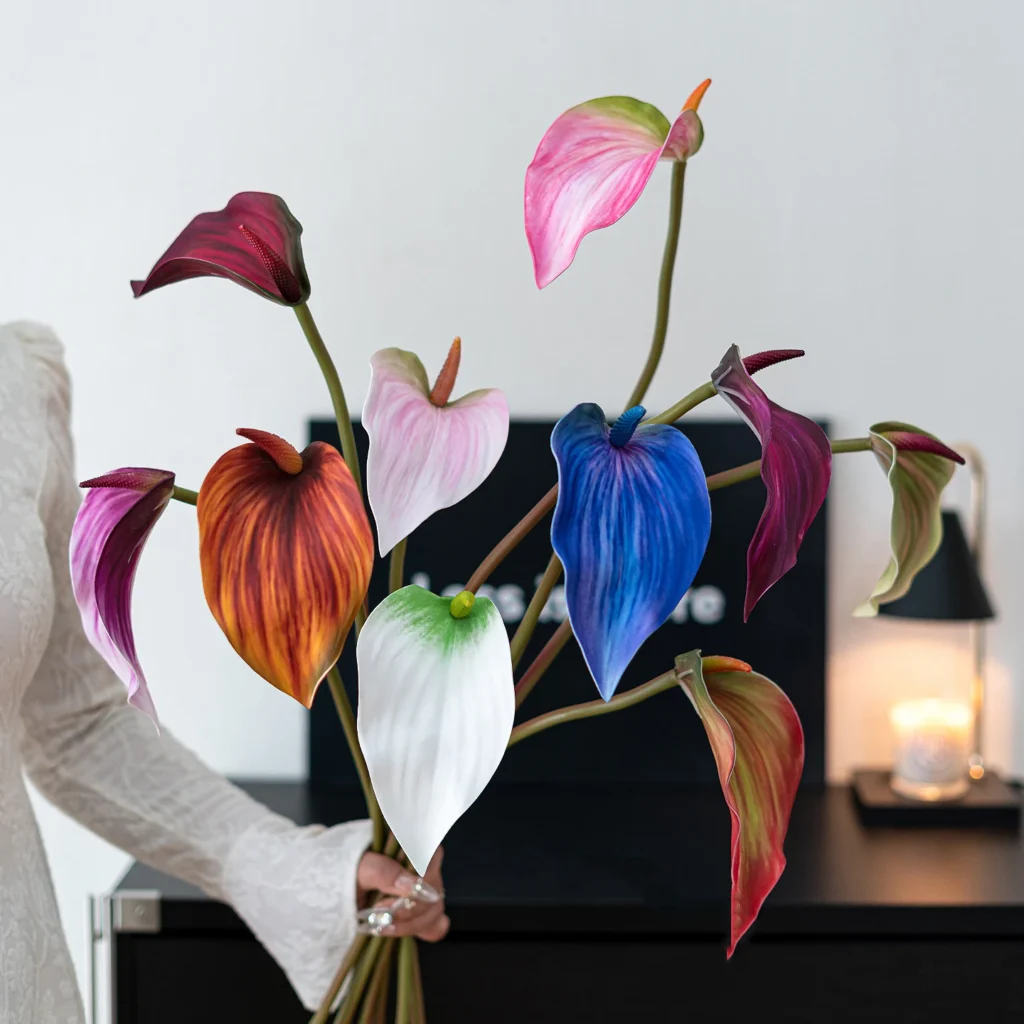 Artificial anthurium stem with one glossy spathe and an upright spadix, styled in a room setting