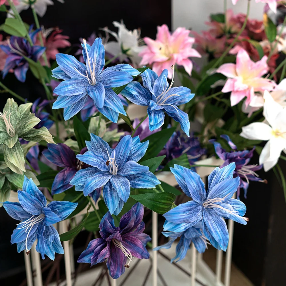 Artificial clematis stem with three open star-shaped flowers with the full colour range