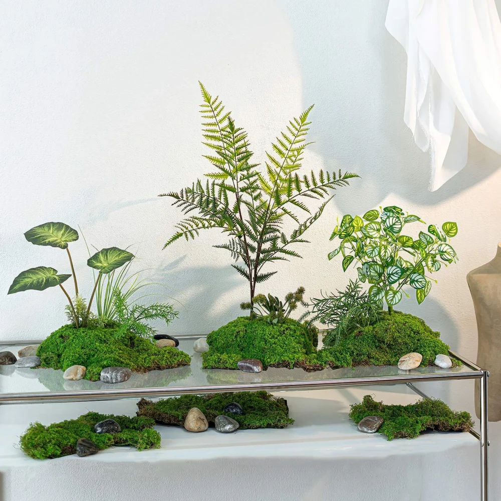 Artificial fern arrangement rooted into a raised moss mound, styled in a room setting