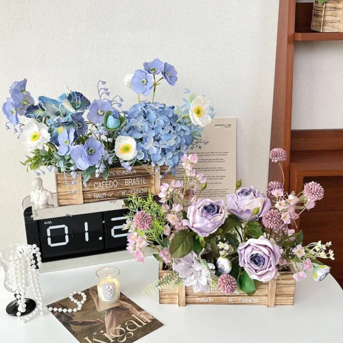 Blue and white artificial flower box arrangement in a rustic printed wooden crate