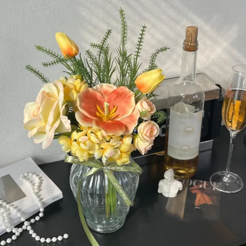 Peach artificial flower posy of hand-tied silk blooms and foliage, styled in a room setting