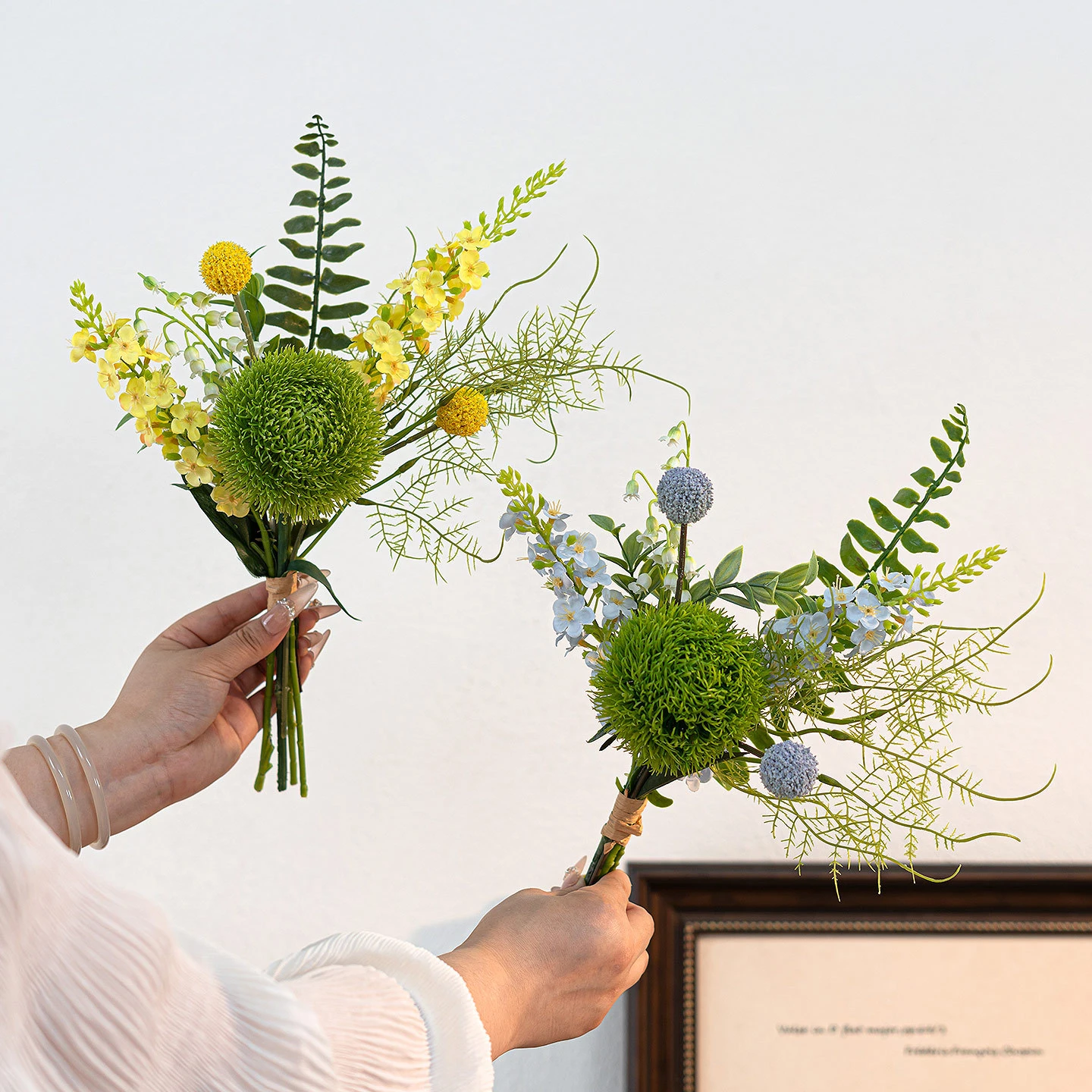 Artificial freesia and green dianthus posy built round one tight green dianthus head with the full colour range