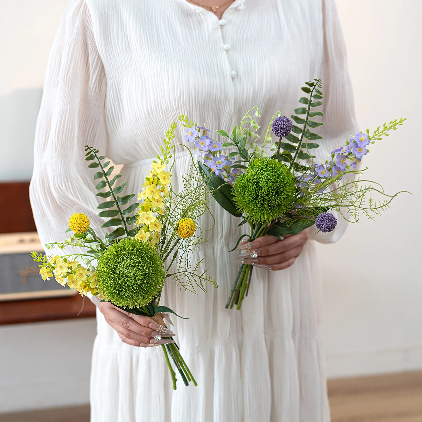 Artificial freesia and green dianthus posy built round one tight green dianthus head, styled in a room setting