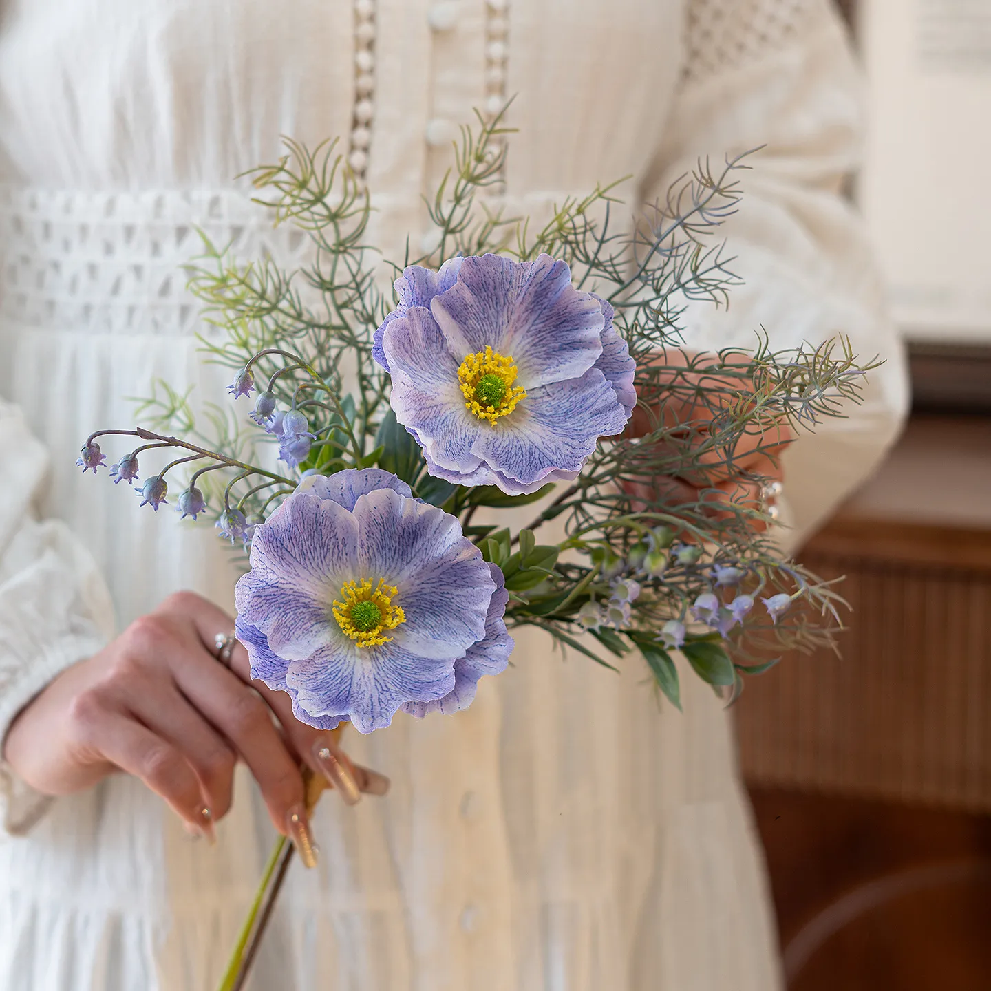 Lavender artificial Iceland poppy stem with buds and fine fern foliage shown close up