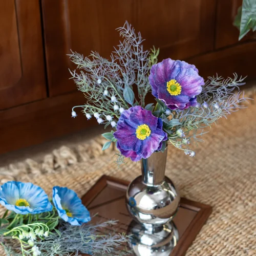 Purple artificial Iceland poppy stem with buds and fine fern foliage, arranged in a vase