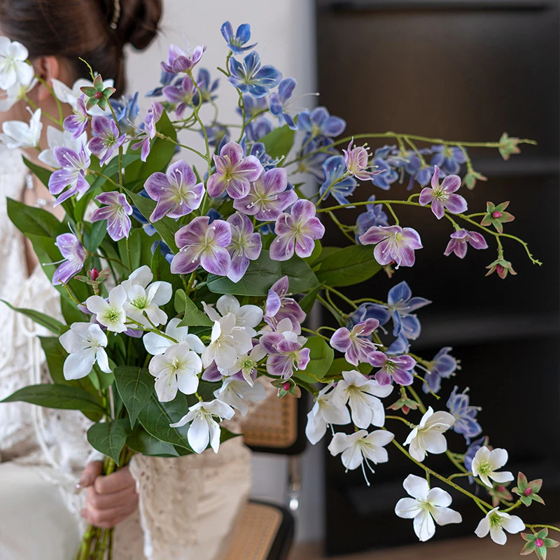 Long stem artificial flower spray with small five-petal blooms on a fine branching stem with the full colour range