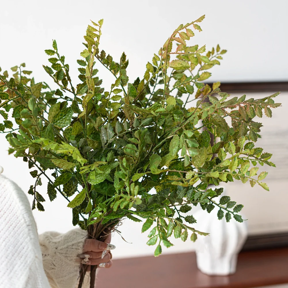 Bronze tinted artificial maidenhair fern stem on fine black wire stems, styled on a table top
