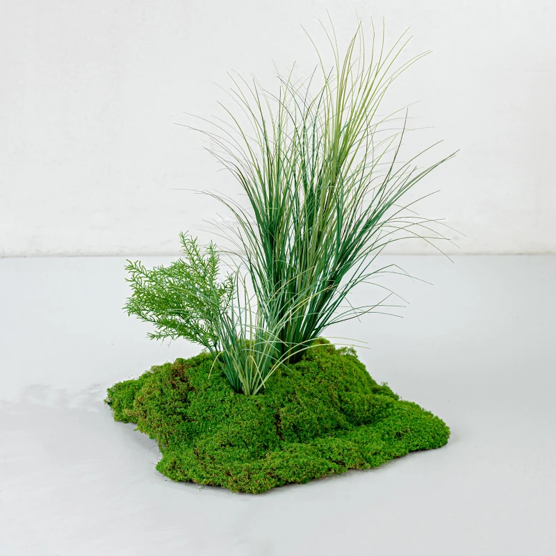 Grass artificial moss arrangement on a shaped moss base with mixed foliage