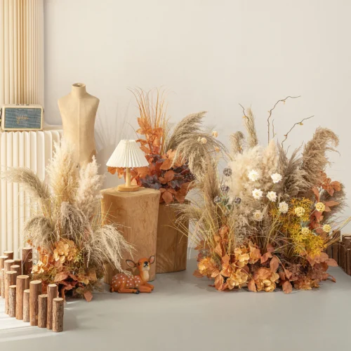 Artificial pampas grass arrangement built as a floor-standing installation, styled in a room setting
