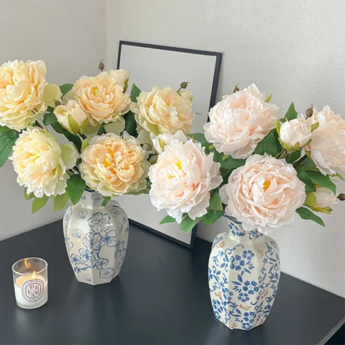 Artificial peony stem with one full double bloom and a closed bud, arranged in a vase