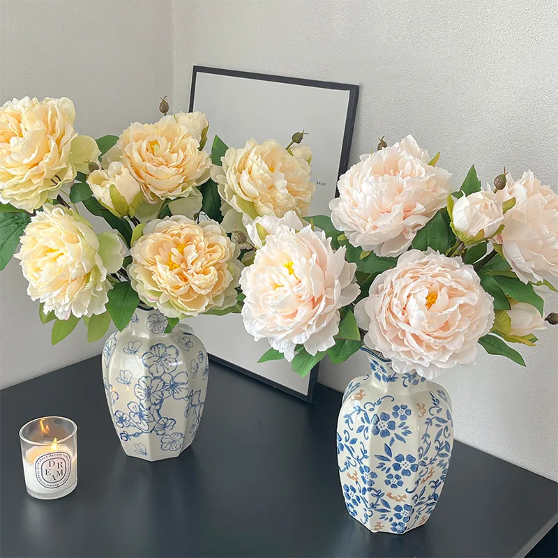 Artificial peony stem with one full double bloom and a closed bud, arranged in a vase