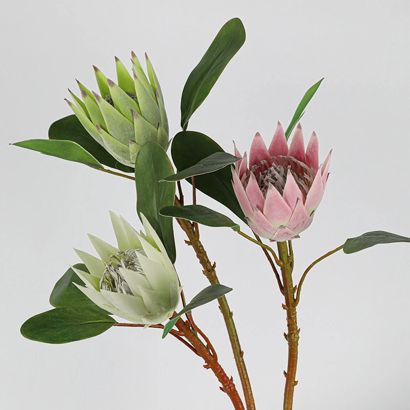 Pink and cream pair artificial protea stem with a cone head and broad leathery leaves