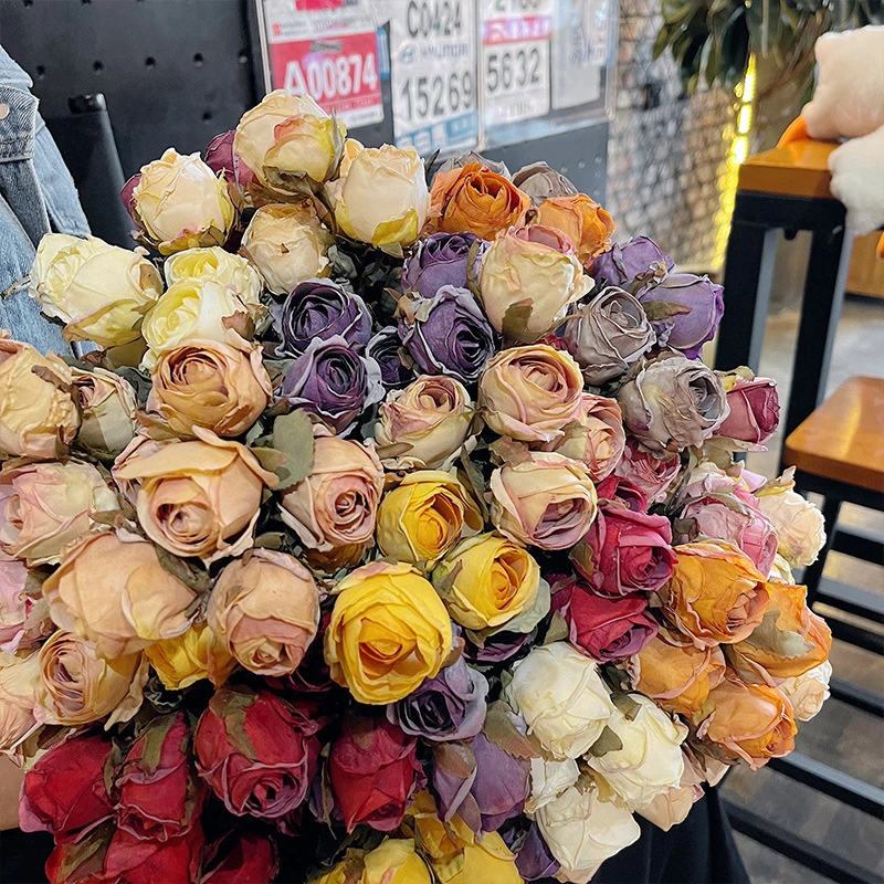 Artificial rose bunch of twelve half-open buds on one tie with the full colour range