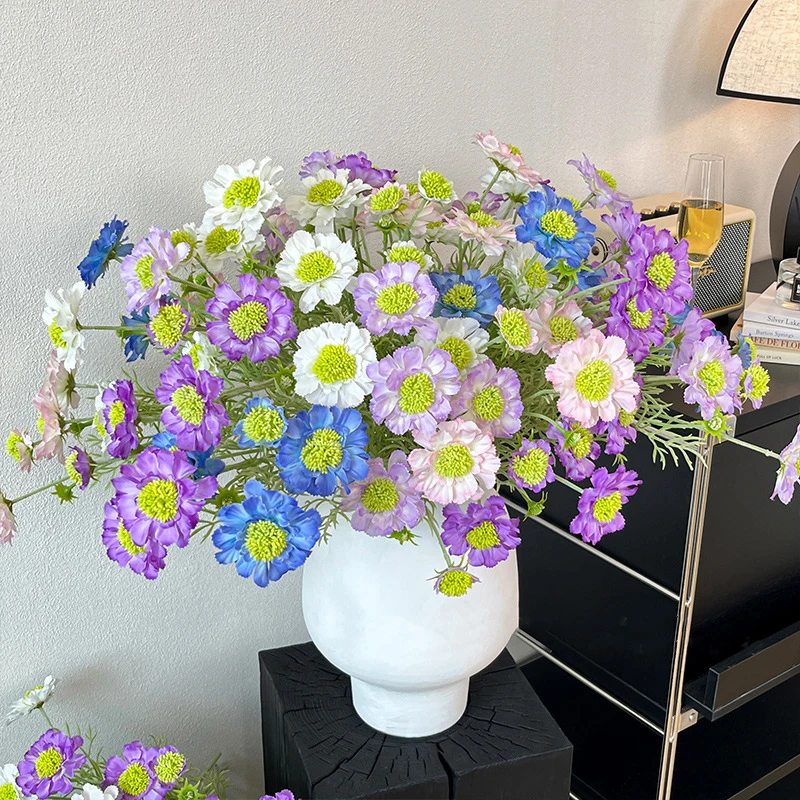 Artificial scabiosa stem with a lime-green pincushion centre and feathered leaves, arranged in a vase