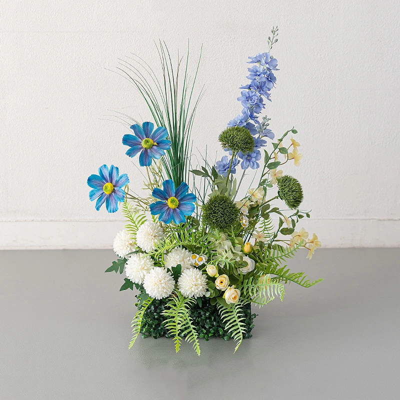 Blue daisy artificial window box arrangement planted into a clipped boxwood mat