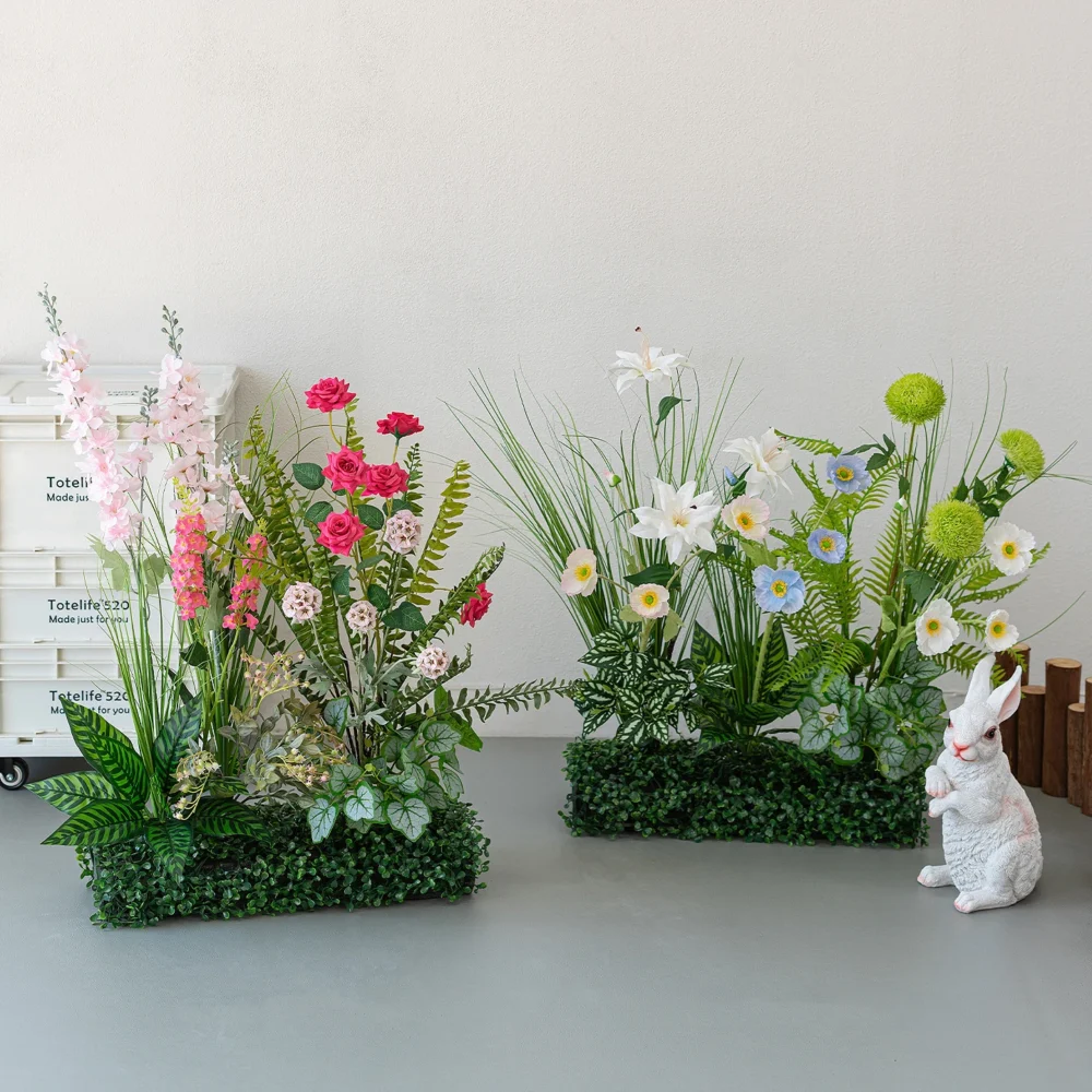 Artificial window box arrangement planted into a clipped boxwood mat with the full colour range