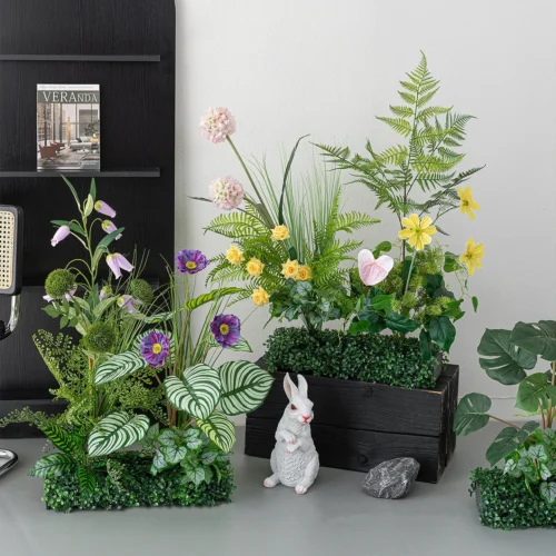 Artificial window box arrangement planted into a clipped boxwood mat, styled in a room setting