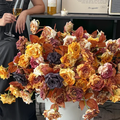 Autumn artificial rose stem in faded rust and amber with copper leaves with the full colour range