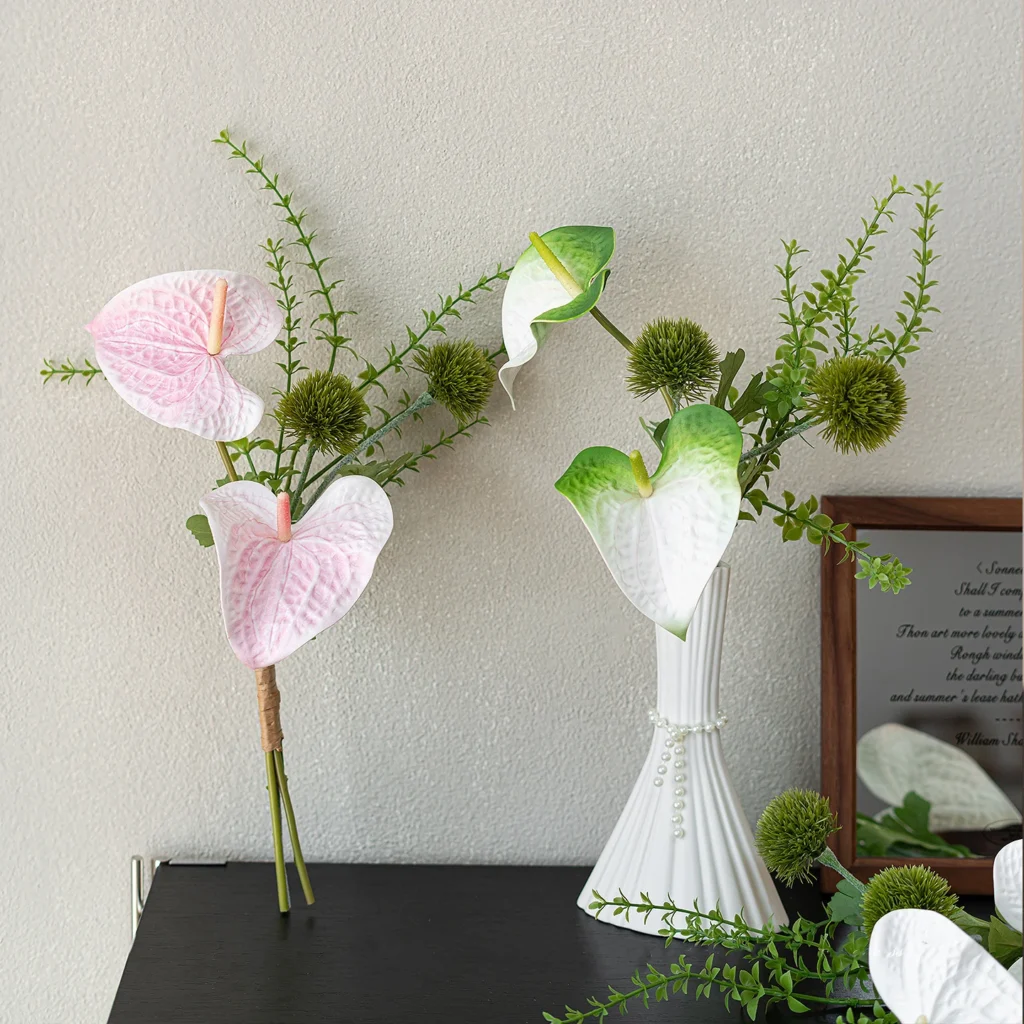 Artificial bud vase arrangement of two anthurium and one spiked green stem with the full colour range
