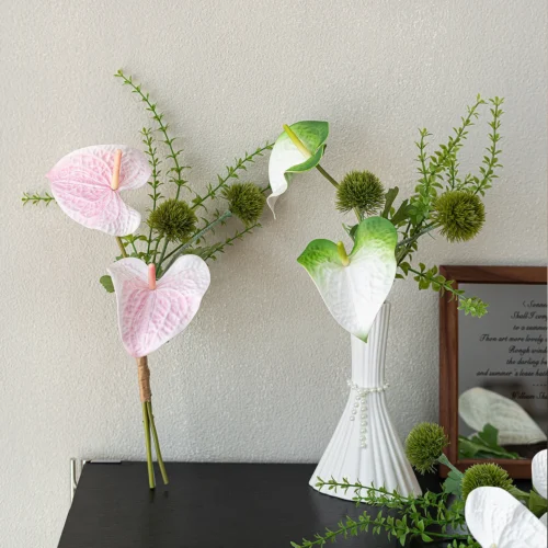 Artificial bud vase arrangement of two anthurium and one spiked green stem with the full colour range