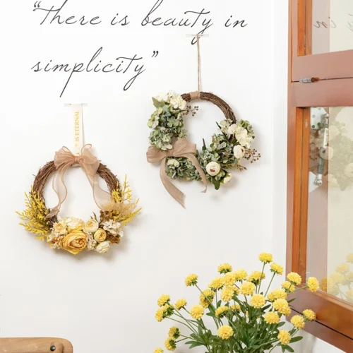 Artificial dried flower wreath on a bare twig ring, styled in a room setting