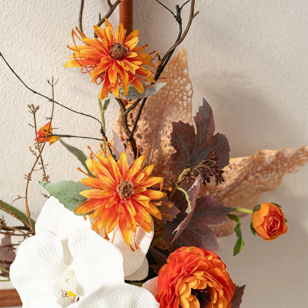 Artificial floral wall art frame on an open wooden frame shown close up