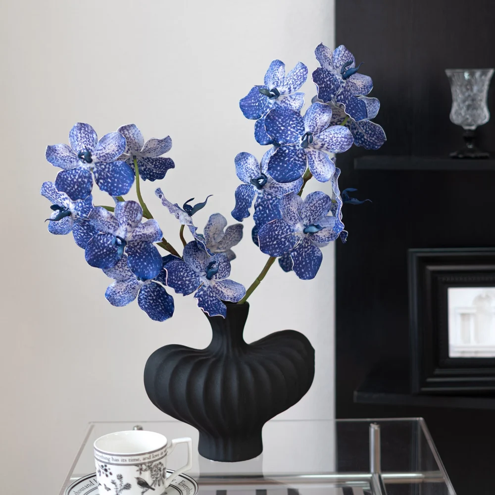 Blue large artificial orchid spray with a dense head of speckled vanda blooms, arranged in a vase