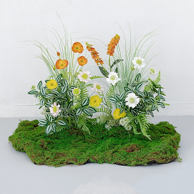Yellow and orange large artificial woodland arrangement on a wide moss base