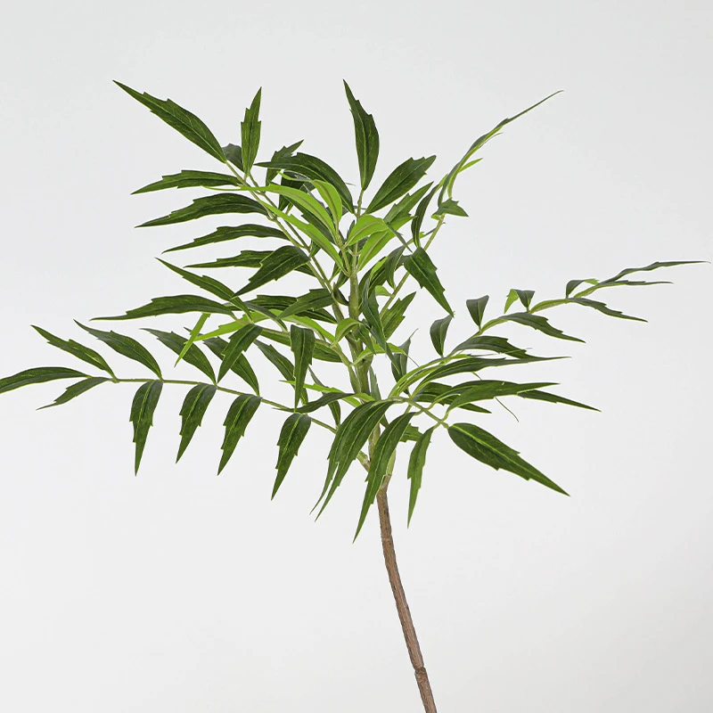 Wide branch artificial bamboo stem with narrow leaves layered along a jointed cane