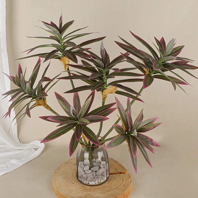 Two-tone artificial branching plant stem forking into three to five heads on one stem, styled in a room setting