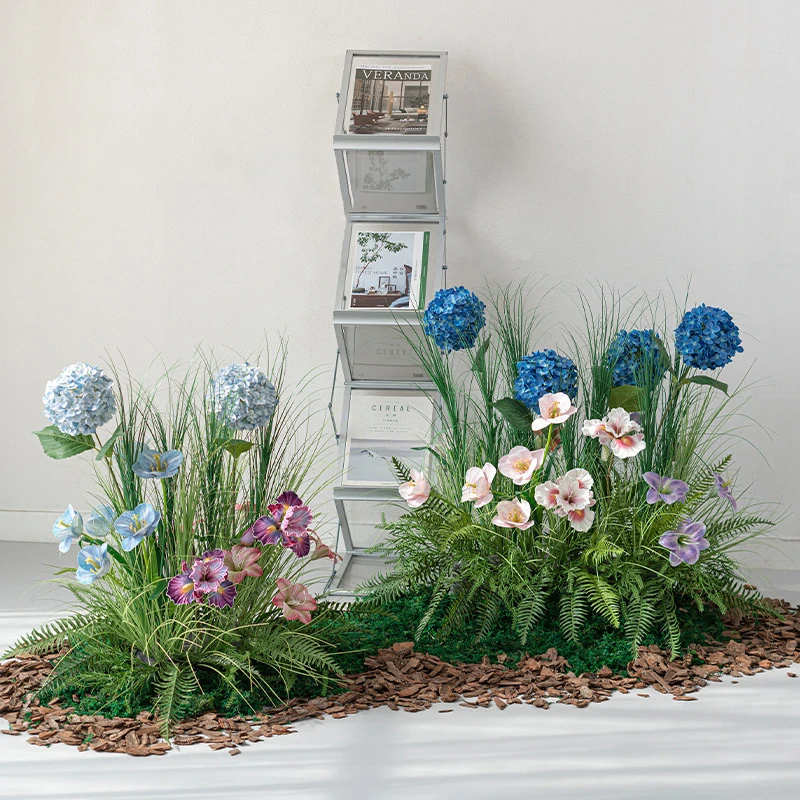 Blue artificial grass and flower landscape, a strip of meadow on a long base, styled in a room setting
