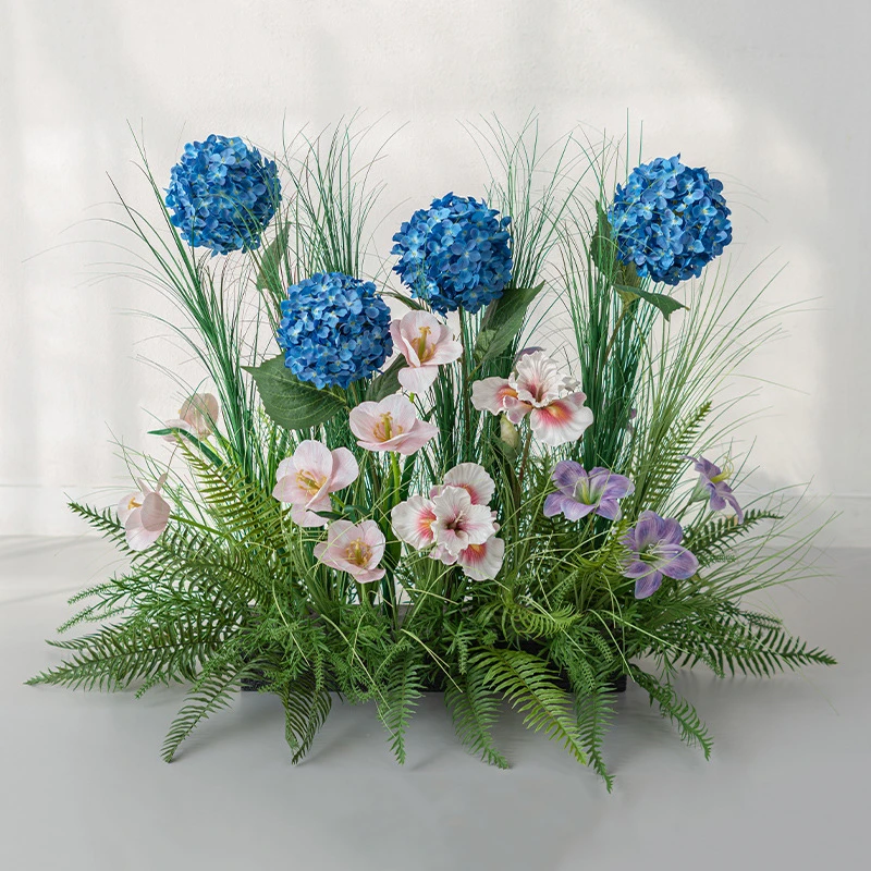 Cornflower blue artificial grass and flower landscape, a strip of meadow on a long base, styled on a table top