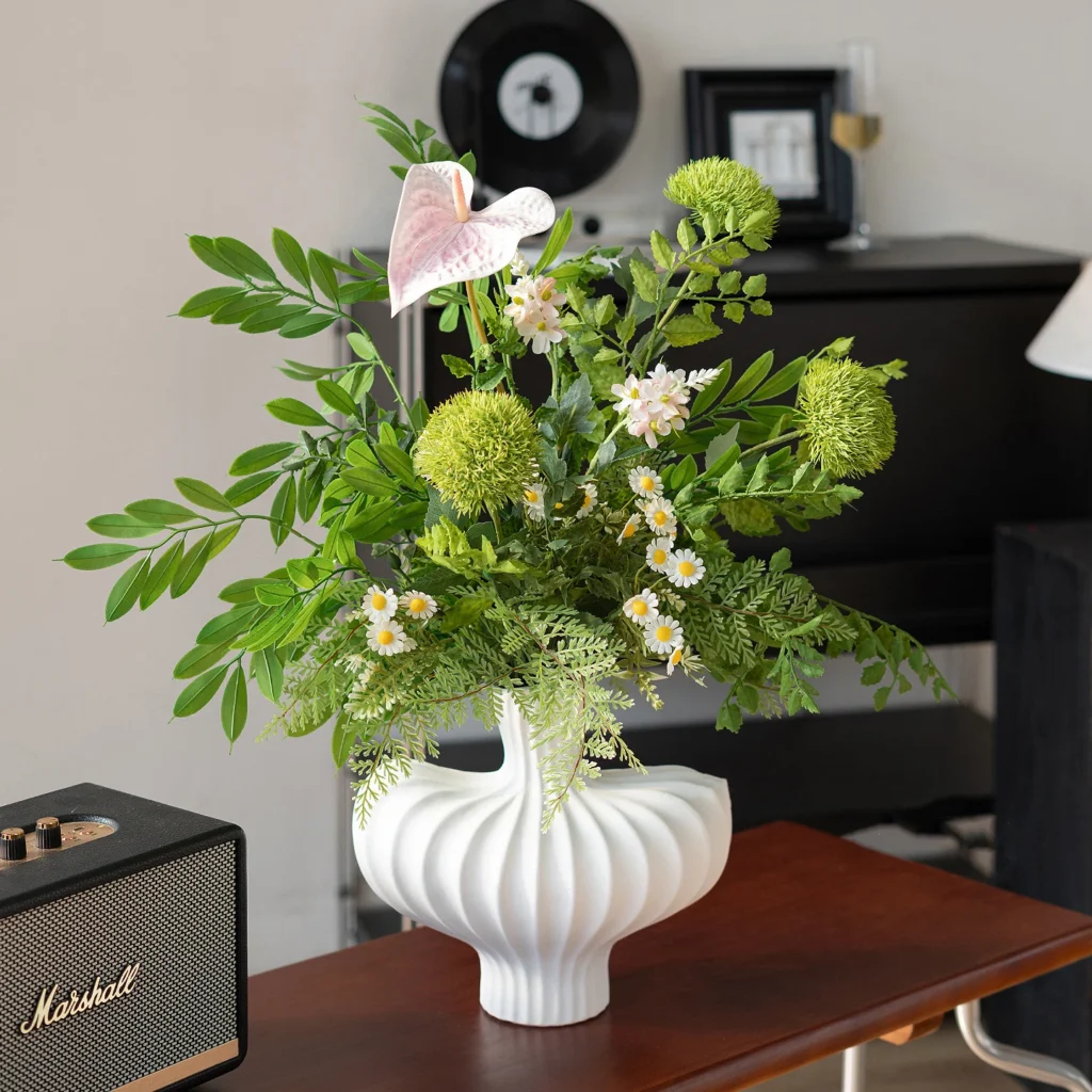 White anthurium artificial greenery bunch of mixed ferns, eucalyptus and berry stems, arranged in a vase