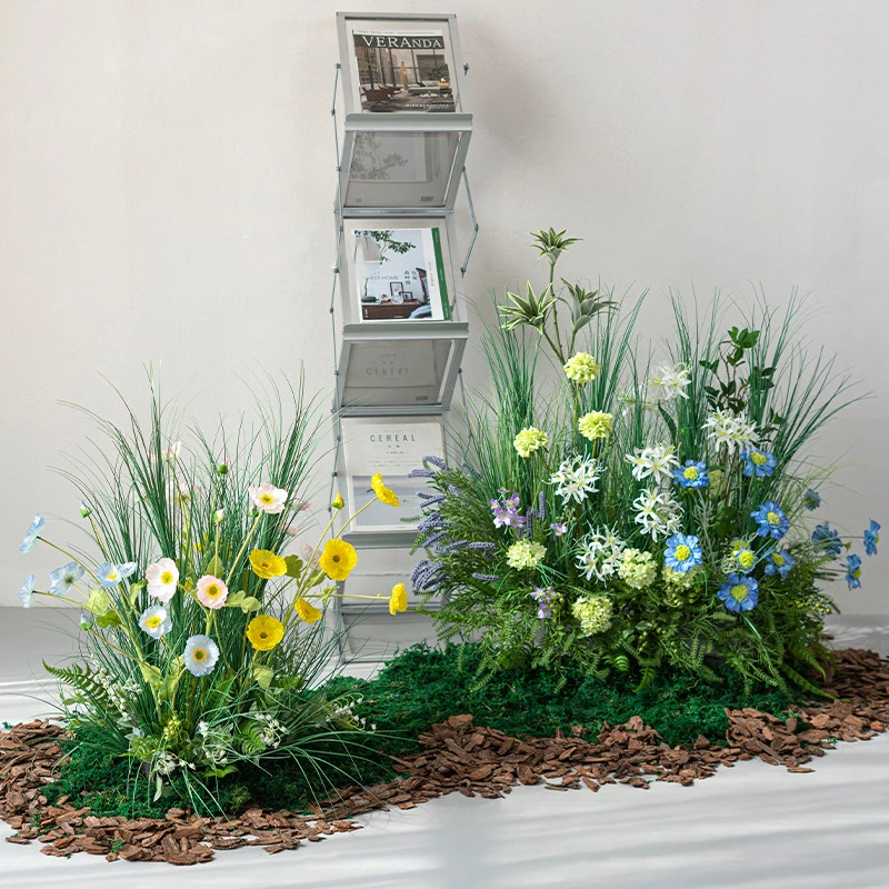 Cornflower artificial ornamental grass border on a bark and moss base, styled in a room setting
