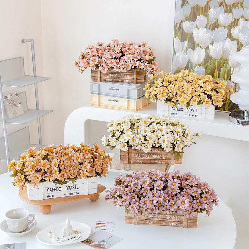Colour range artificial window box of daisies packed into a stencilled coffee crate with the full colour range
