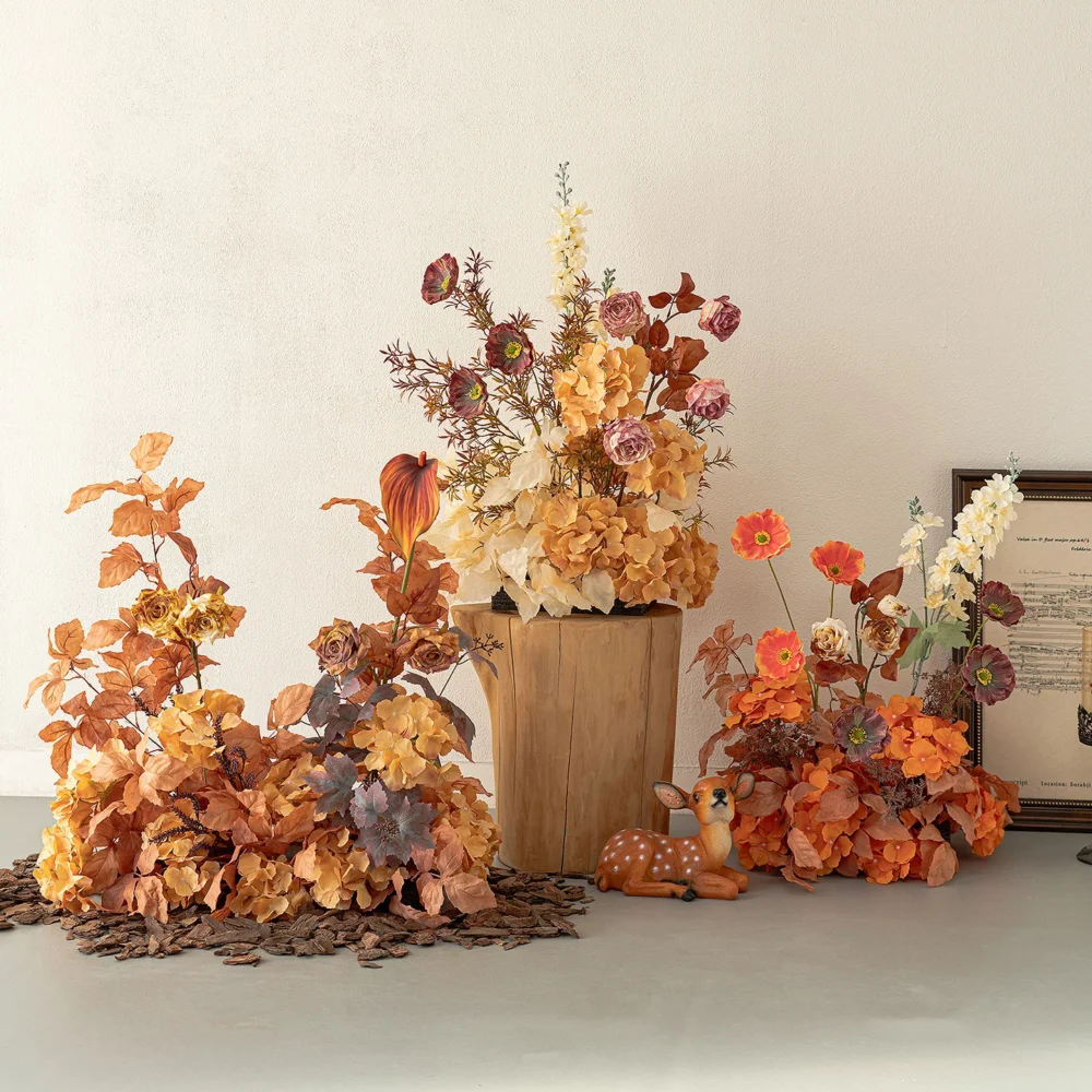 Rust autumn artificial flower arrangement in rust, copper and burnt orange, styled in a room setting