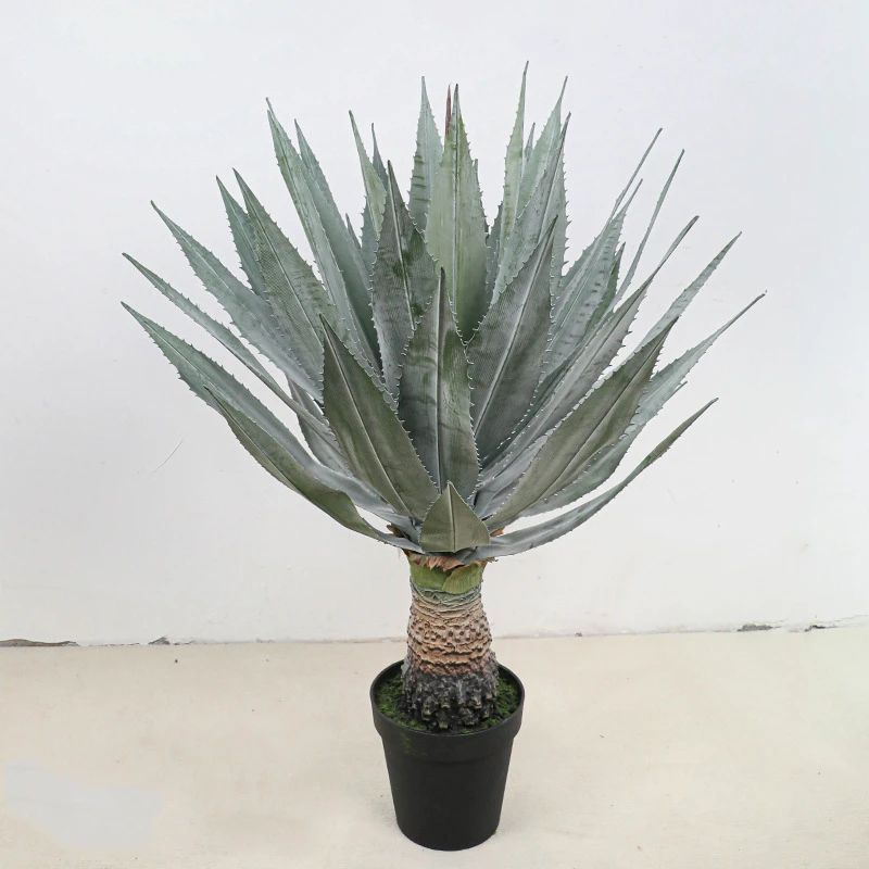 Blue grey on a trunk potted artificial agave finished in a plain black grower's pot